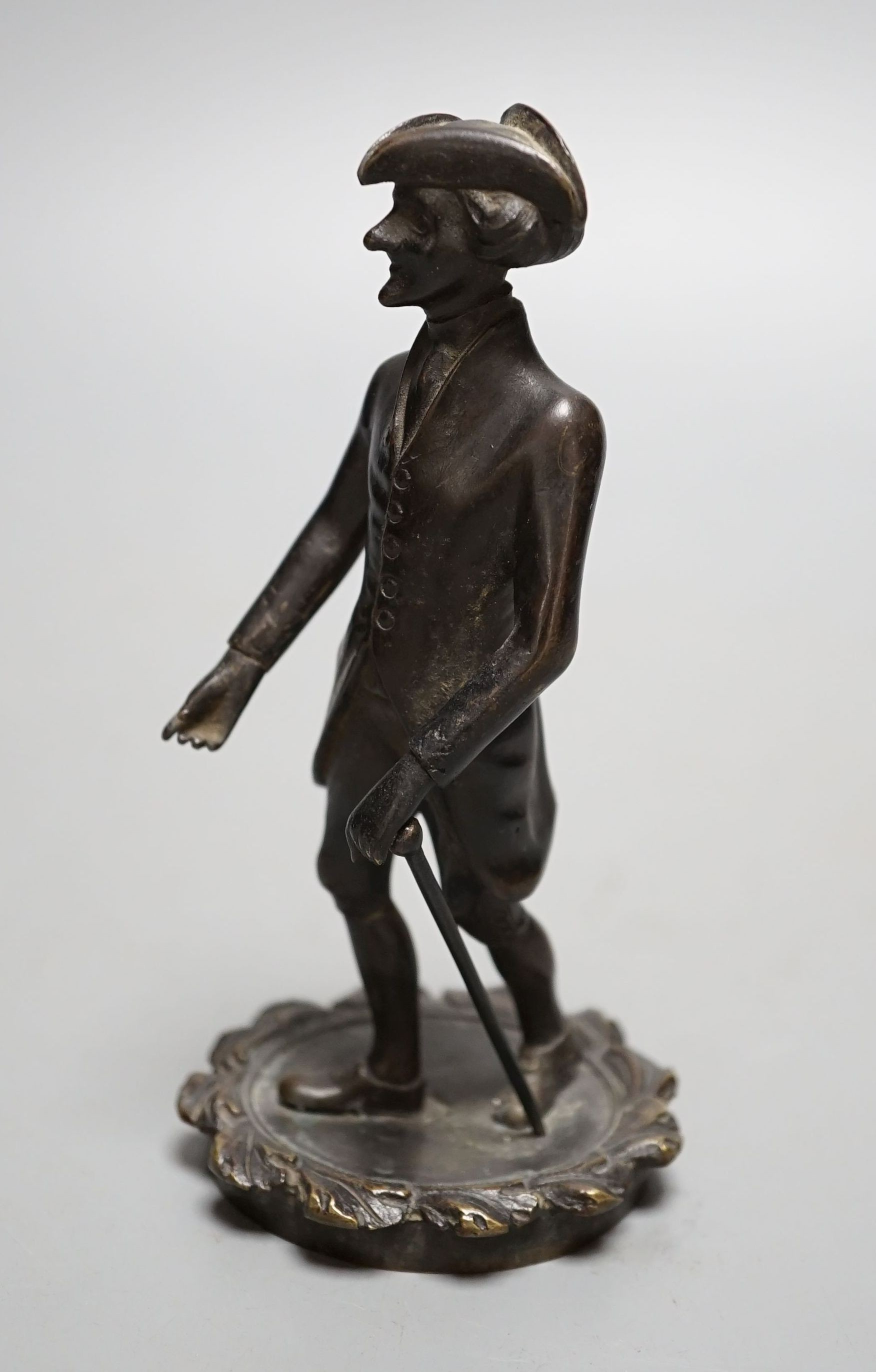 A Regency bronze tobacco box, surmounted by a figure of Dr. Syntax - 20cm tall